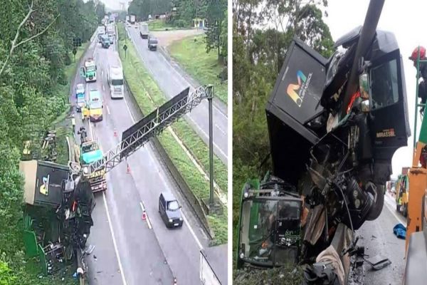 Caminhão tomba após bater contra mureta e motorista fica ferido na divisa do PR com SC