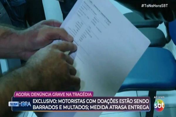 Reportagem flagra cobrança de nota fiscal e multas a caminhões de doação no RS; ANTT diz "Fake News"